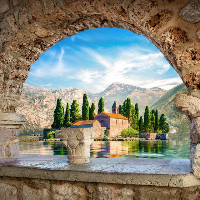 View on St George island from Our Lady of the Rocks through arch. Perast, Montenegro