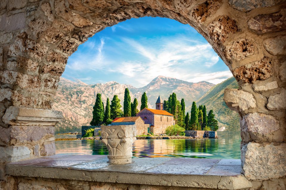 View on St George island from Our Lady of the Rocks through arch. Perast, Montenegro